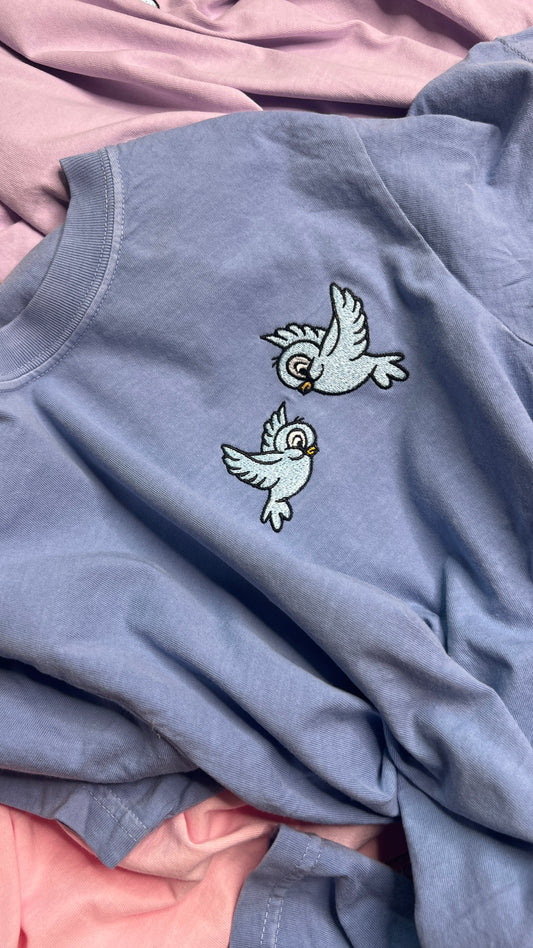 Light blue princess birds ( DESIGN IS ON SIDE NOT CENTER!!  ) short sleeve regular embroidered tshirt. !!! EST tat BEGINNING OF AUGUST ! ! NOT CROPPED !!!